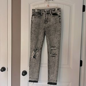 Distressed black and white jeans